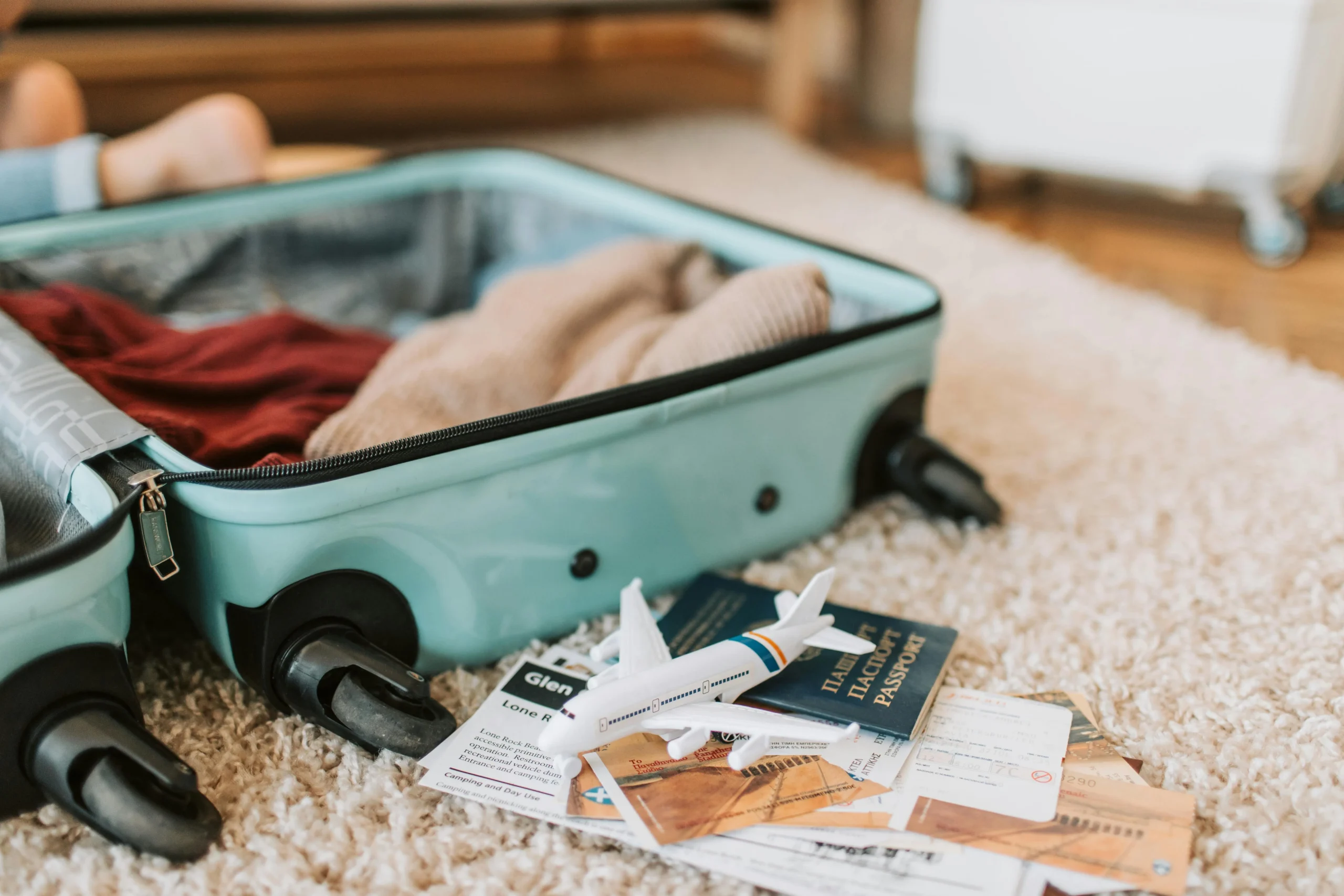 family travel routines with parents organizing passports snacks and travel bags before a trip with children