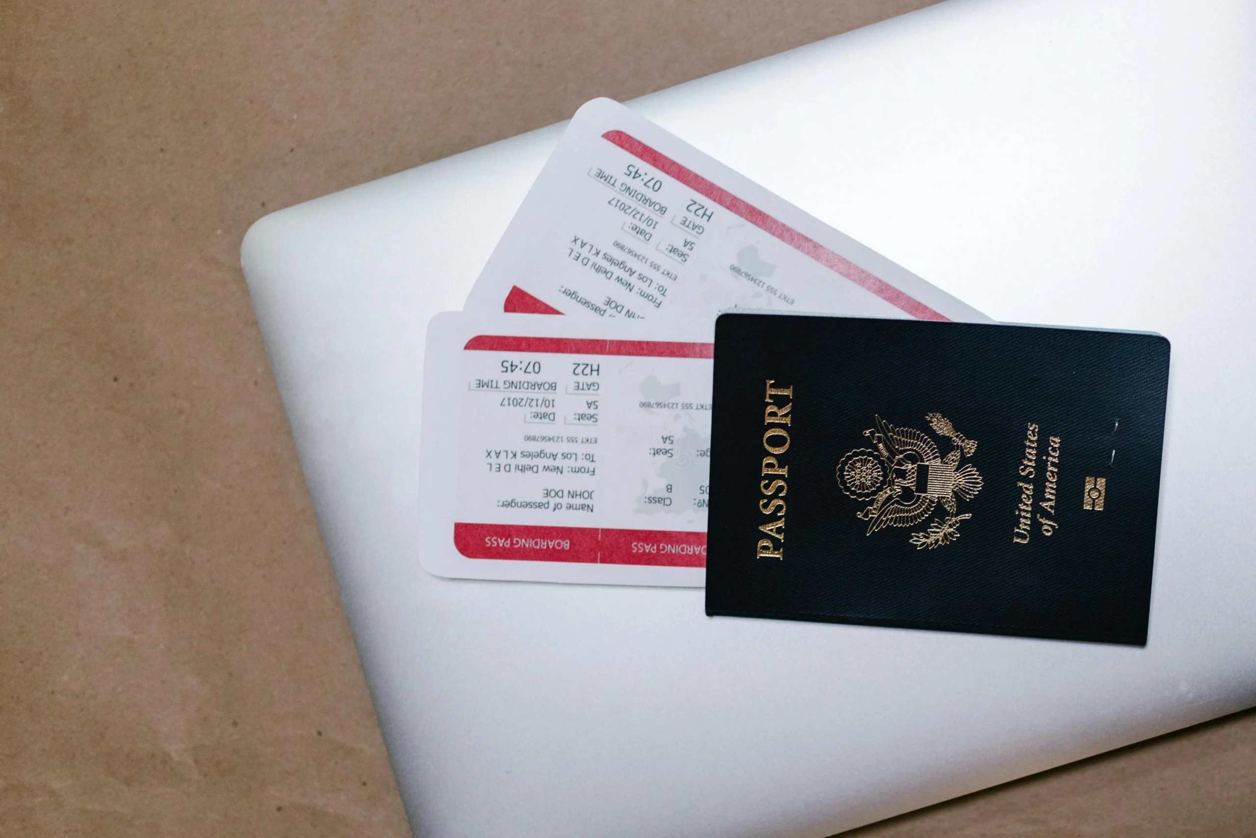 flight prep habits with a traveler checking passport booking details and a carry-on before airport day
