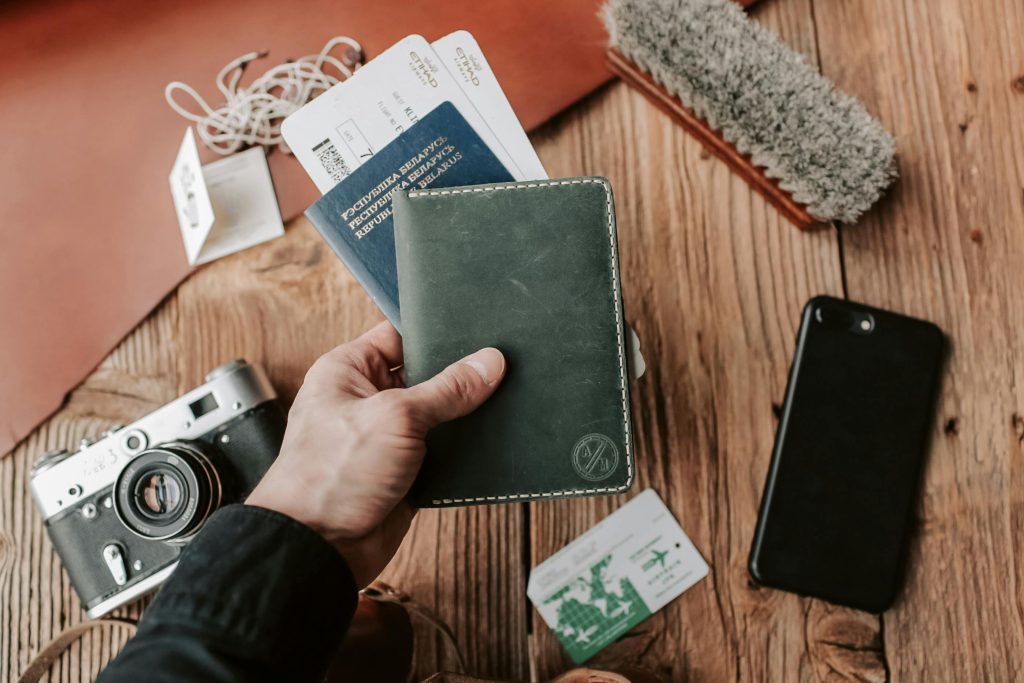 solo travel habits showing organized passport wallet and phone in a small travel bag