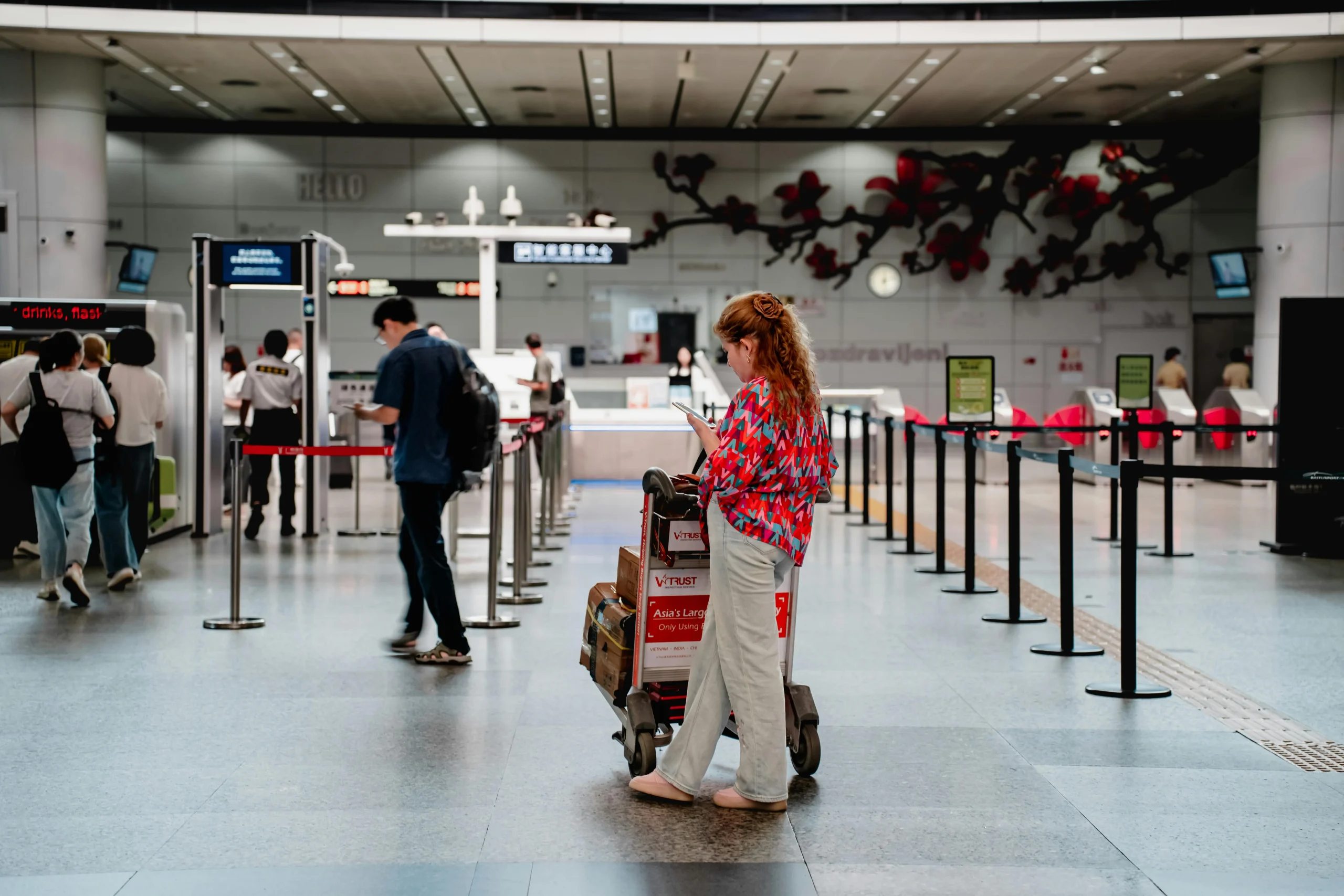 respectful travel habits showing a traveler stepping aside to check transport details calmly