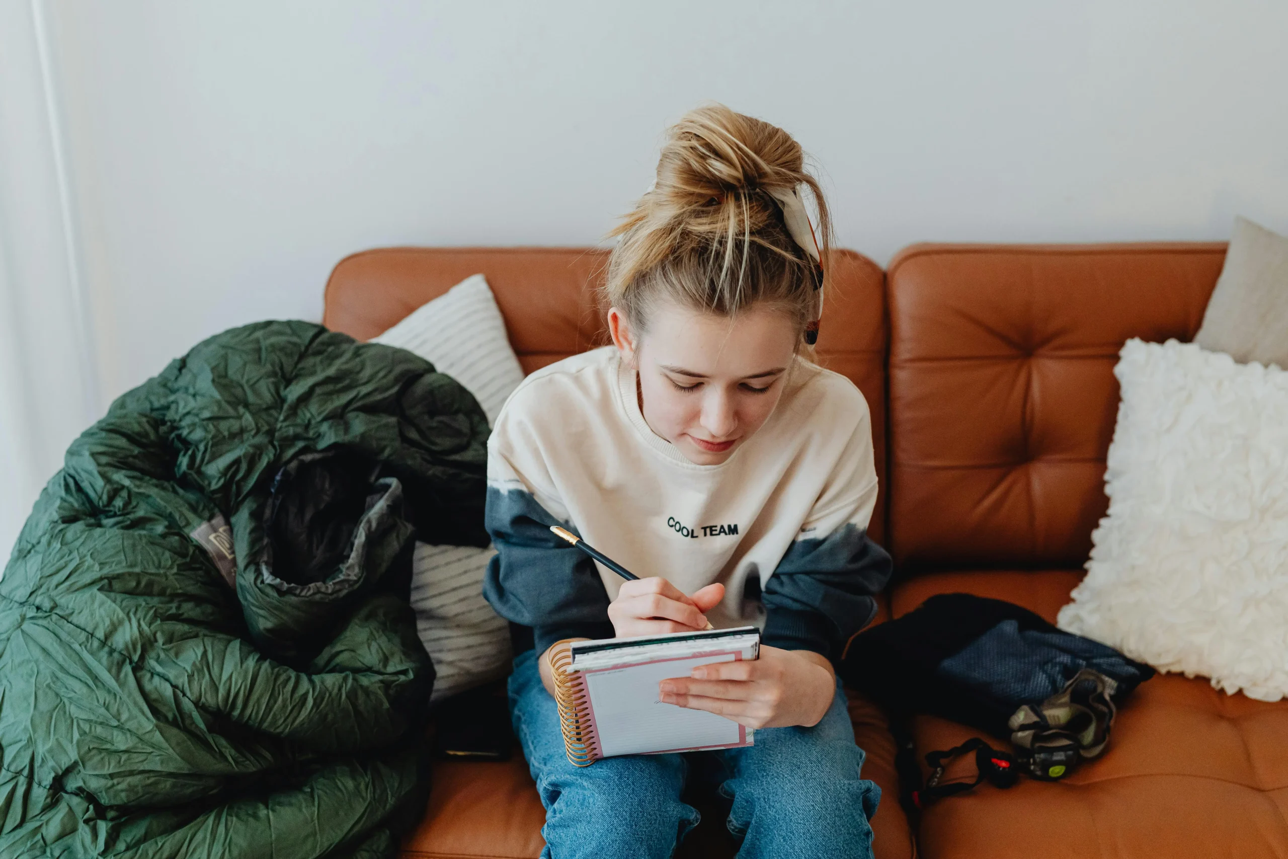 trail-timing-habits-showing-a-hiker-writing-route-notes-and-a-turn-around-time-before-hiking-scaled 8 Trail Timing Habits That Help Outdoor Travelers Stay Safer All Day