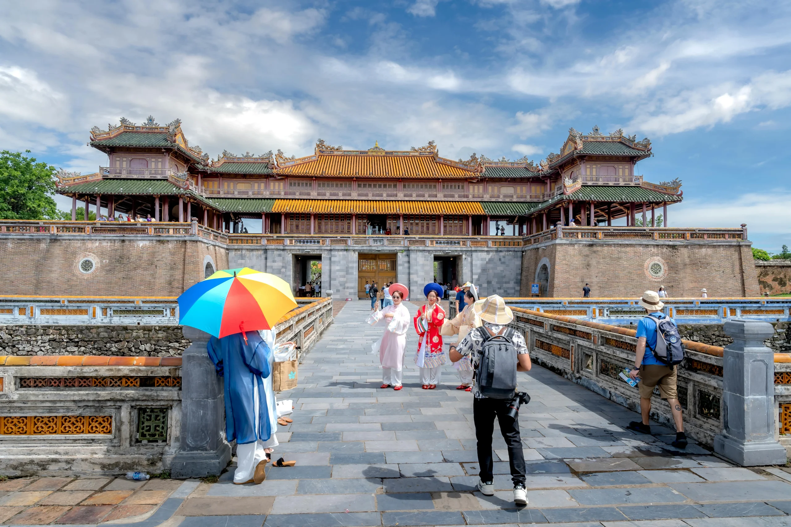 travel etiquette habits showing visitors dressed respectfully at a cultural site abroad
