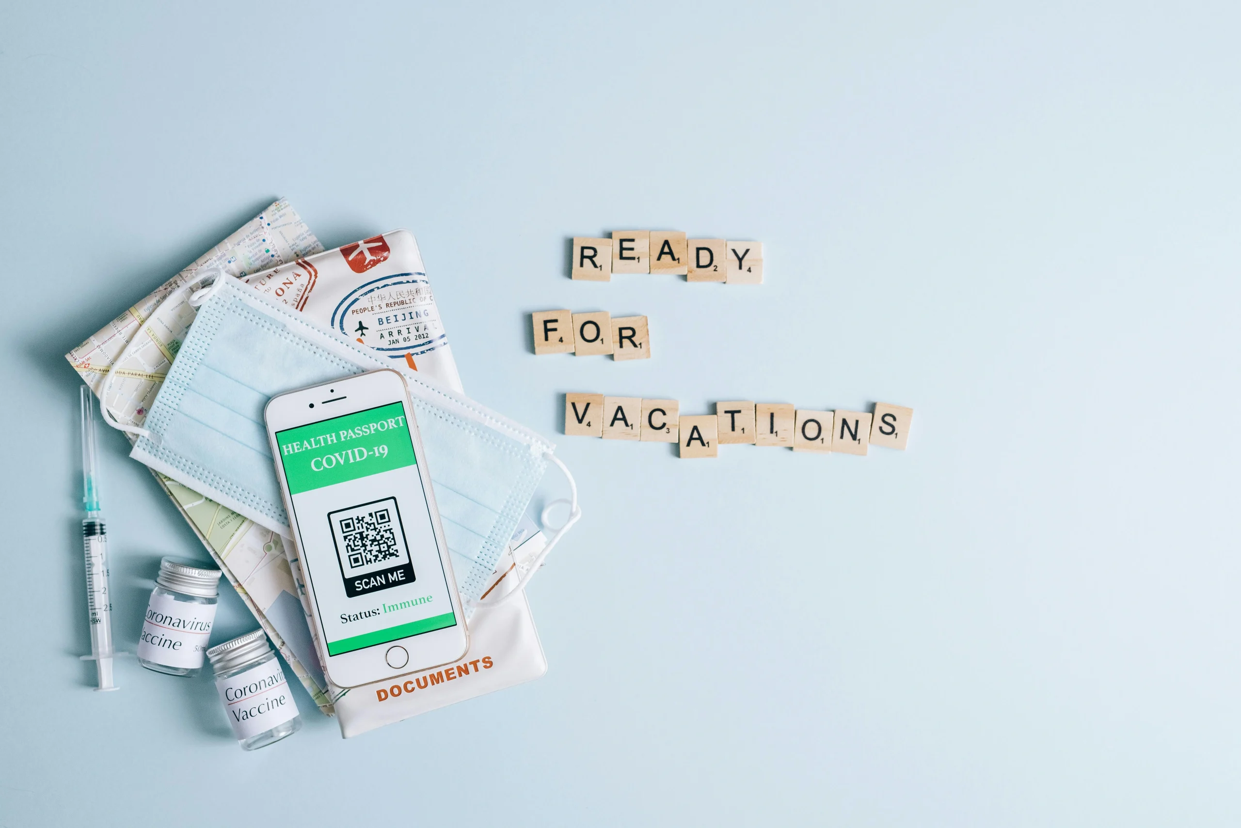 travel health habits with medicine passport and a small health kit prepared before international travel