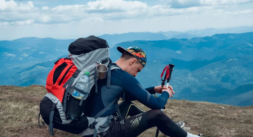 hiker resting with backpack