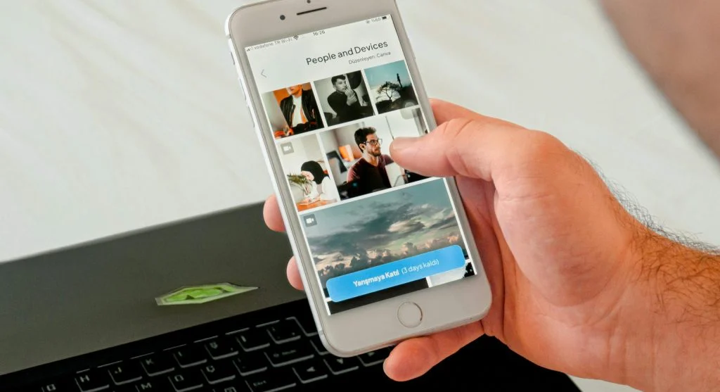 traveler checking Wi-Fi on phone and laptop