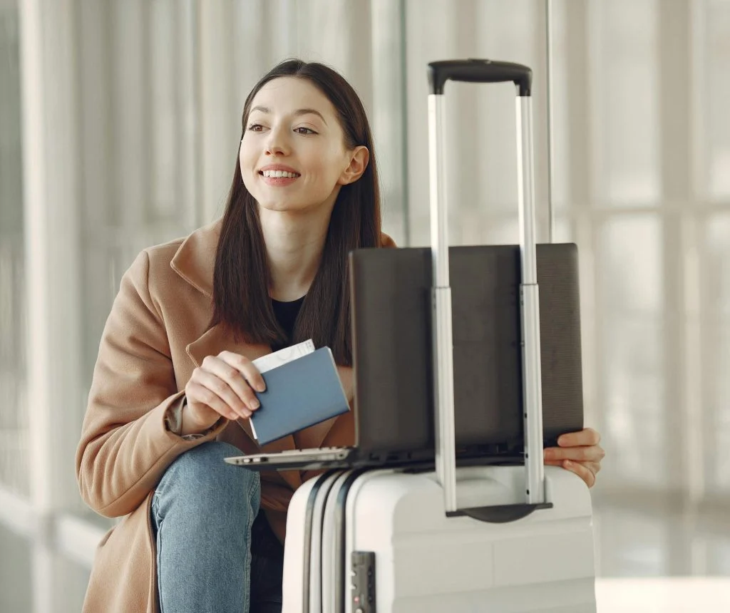 Person checking flight prices and travel notes