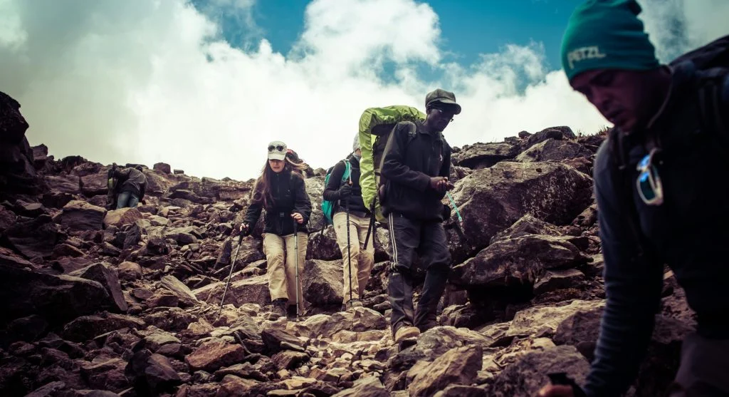 hiker checks cloud map on trail