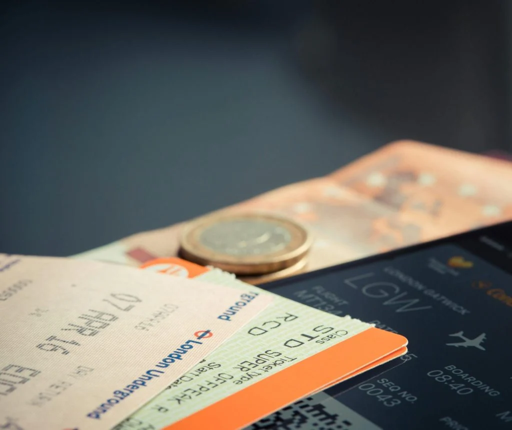 Person comparing airline prices and travel notes