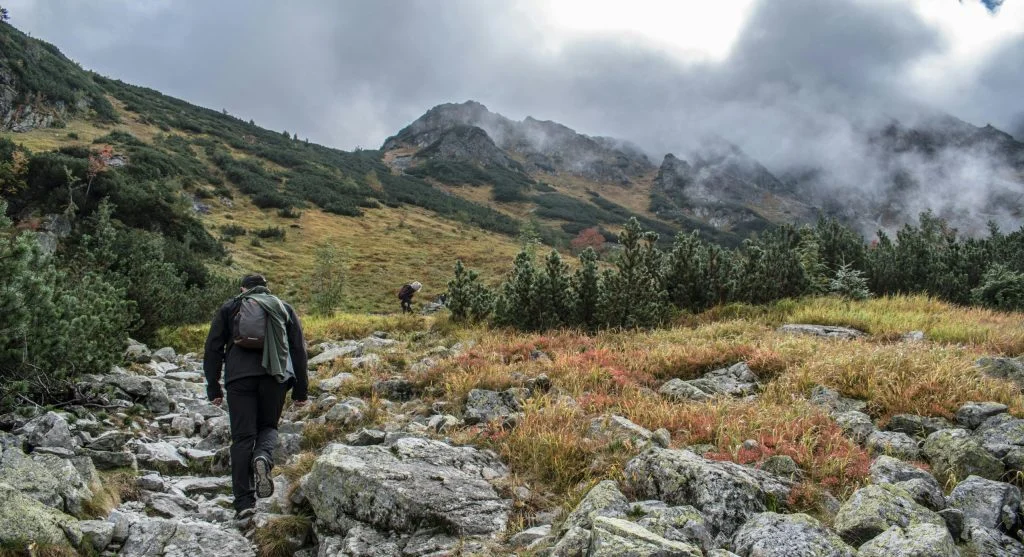Beginner hiker on a scenic trail with a backpack